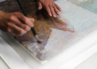Illustration for article titled How a $12 Million Monet Was Repaired After Some Idiot Punched ItÂ